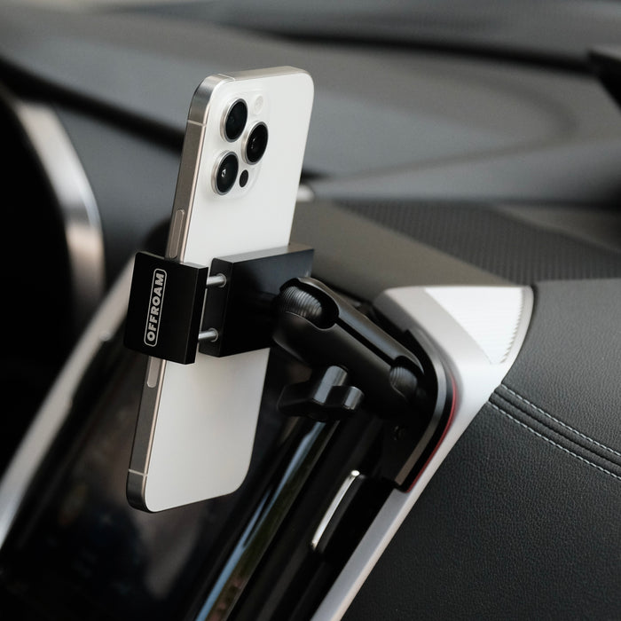 Image of Offroam Phone Mount installed securely in Subaru Ascent 2019-2022. This premium phone mount installs easily without drilling or glue. Spring loaded Universal holder for use with any phone. Perfect placement without blocking screens, driver view, or air flow. Fully adjustable positioning.