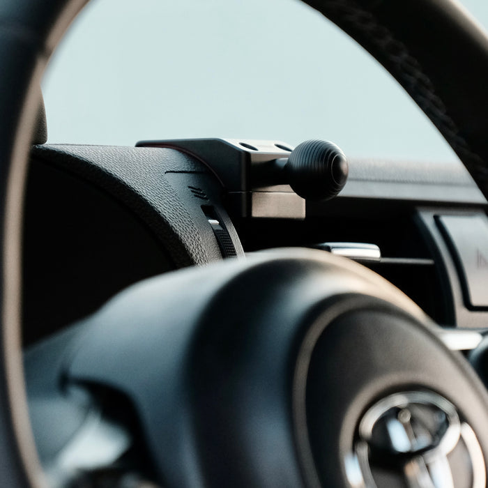 Image of Offroam Mounting Base installed securely in Subaru BRZ 2022-2026 | Toyota GR86 2022-2026. This premium all metal phone mounting base installs easily without drilling or glue. Perfect placement without blocking screens, driver view, or air flow.