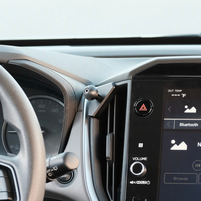 Image of Offroam Mounting Base installed securely in Subaru Crosstrek 2024-2026 | Impreza 2024-2026 | WRX 2022-2026. This premium all metal phone mounting base installs easily without drilling or glue. Perfect placement without blocking screens, driver view, or air flow.