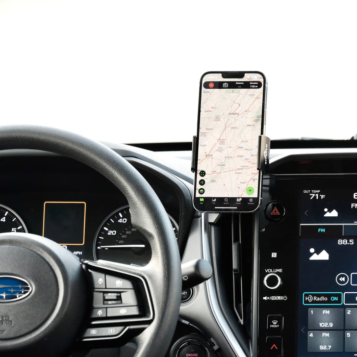 Image of Offroam Phone Mount installed securely in Subaru Crosstrek 2024-2026 | Impreza 2024-2026 | WRX 2022-2026. This premium phone mount installs easily without drilling or glue. Spring loaded Universal holder for use with any phone. Perfect placement without blocking screens, driver view, or air flow. Fully adjustable positioning.