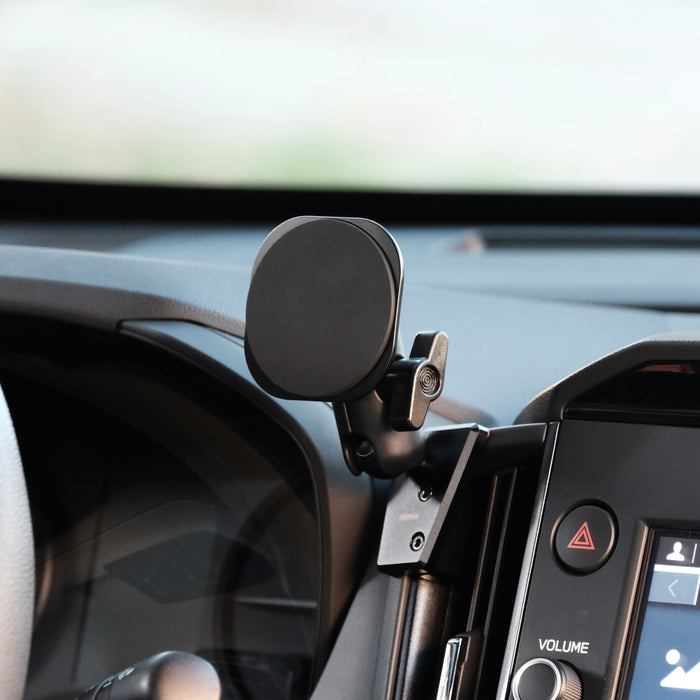 Image of Offroam MagSafe-compatible Phone Mount installed securely in Subaru Forester 2025-2026. This premium phone mount installs easily without drilling or glue. High force magnets hold phone on any trail, road, or track. Perfect placement without blocking screens, driver view, or air flow. Fully adjustable positioning.