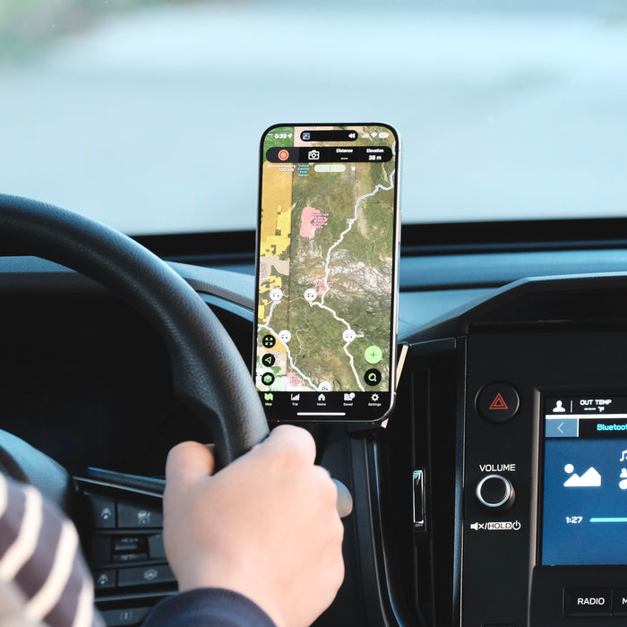 Image of Offroam MagSafe-compatible Phone Mount installed securely in Subaru Forester 2025-2026. This premium phone mount installs easily without drilling or glue. High force magnets hold phone on any trail, road, or track. Perfect placement without blocking screens, driver view, or air flow. Fully adjustable positioning.