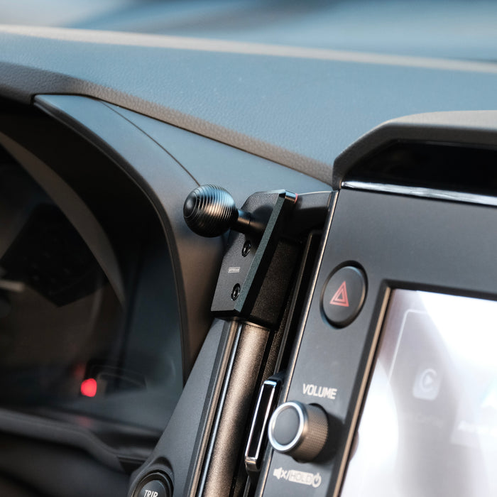 Image of Offroam Mounting Base installed securely in Subaru Forester 2025-2026. This premium all metal phone mounting base installs easily without drilling or glue. Perfect placement without blocking screens, driver view, or air flow.