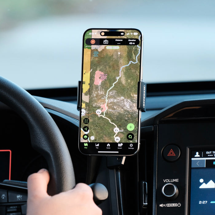 Image of Offroam Phone Mount installed securely in Subaru Forester 2025-2026. This premium phone mount installs easily without drilling or glue. Spring loaded Universal holder for use with any phone. Perfect placement without blocking screens, driver view, or air flow. Fully adjustable positioning.