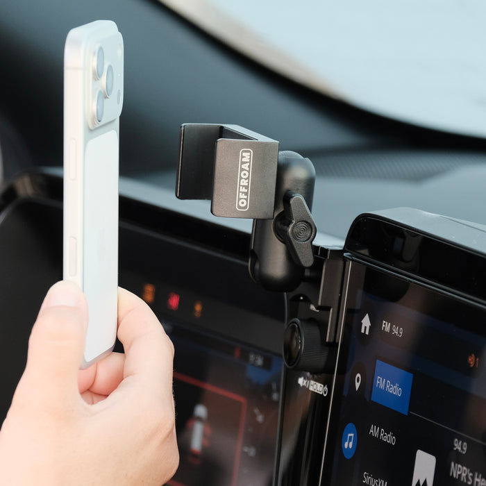 Image of Offroam Phone Mount installed securely in Subaru Outback 2026. This premium phone mount installs easily without drilling or glue. Spring loaded Universal holder for use with any phone. Perfect placement without blocking screens, driver view, or air flow. Fully adjustable positioning.