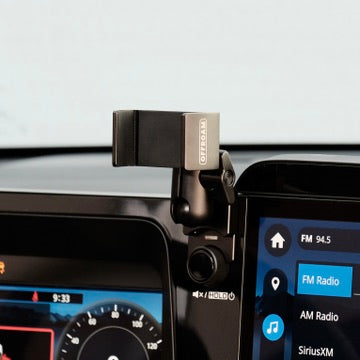Image of Offroam Phone Mount installed securely in Subaru Outback 2026. This premium phone mount installs easily without drilling or glue. Spring loaded Universal holder for use with any phone. Perfect placement without blocking screens, driver view, or air flow. Fully adjustable positioning.