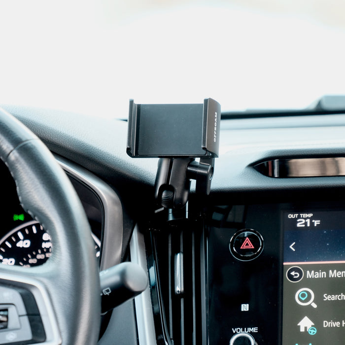 Image of Offroam Phone Mount installed securely in Subaru Outback | Legacy 2020-2025. This premium phone mount installs easily without drilling or glue. Spring loaded Universal holder for use with any phone. Perfect placement without blocking screens, driver view, or air flow. Fully adjustable positioning.