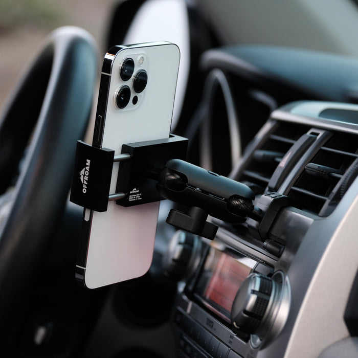 Image of Offroam Phone Mount installed securely in Toyota 4Runner 2010-2013. This premium phone mount installs easily without drilling or glue. Spring loaded Universal holder for use with any phone. Perfect placement without blocking screens, driver view, or air flow. Fully adjustable positioning.