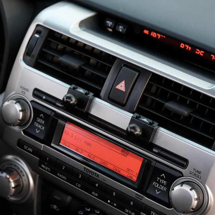 Image of Offroam Mounting Bases installed securely in Toyota 4Runner 2010-2013. This premium all metal phone mounting base installs easily without drilling or glue. Perfect placement without blocking screens, driver view, or air flow.