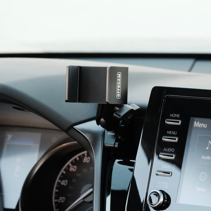 Image of Offroam Phone Mount installed securely in Toyota Camry 2021-2024. This premium phone mount installs easily without drilling or glue. Spring loaded Universal holder for use with any phone. Perfect placement without blocking screens, driver view, or air flow. Fully adjustable positioning.