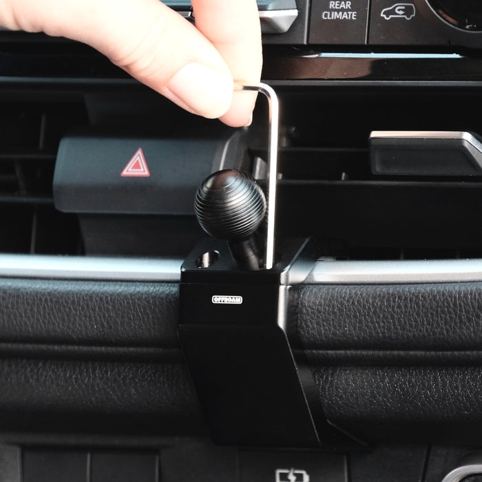 Image of Offroam Mounting Base installation in Toyota Grand Highlander 2024-2026. This premium all metal phone mounting base installs easily without drilling or glue. Perfect placement without blocking screens, driver view, or air flow.