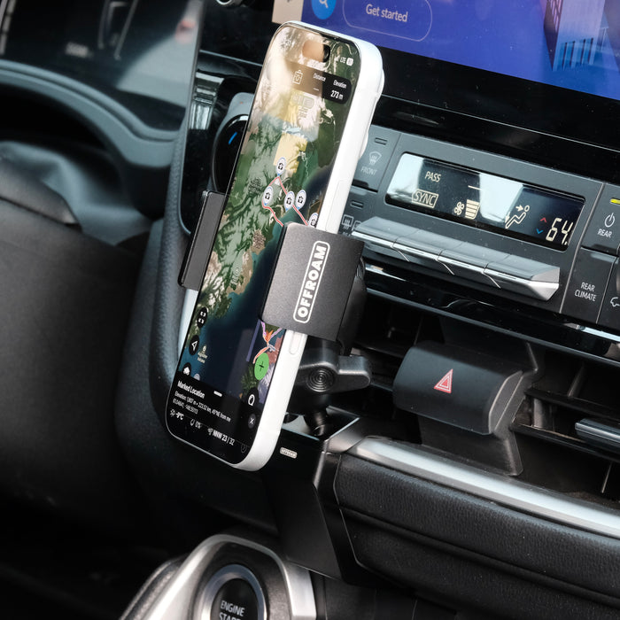 Image of Offroam Phone Mount installed securely in Toyota Grand Highlander 2024-2026. This premium phone mount installs easily without drilling or glue. Spring loaded Universal holder for use with any phone. Perfect placement without blocking screens, driver view, or air flow. Fully adjustable positioning.
