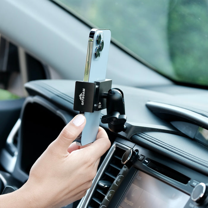 Image of Offroam Phone Mount installed securely in Toyota Highlander 2014-2019. This premium phone mount installs easily without drilling or glue. Spring loaded Universal holder for use with any phone. Perfect placement without blocking screens, driver view, or air flow. Fully adjustable positioning.