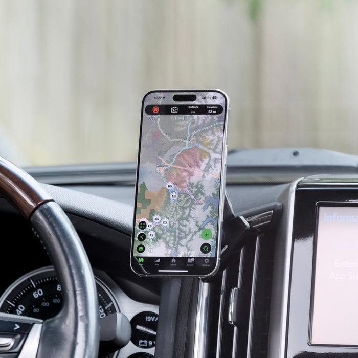 Image of Offroam MagSafe-compatible Phone Mount installed securely in Toyota Land Cruiser 200 2016-2021. This premium phone mount installs easily without drilling or glue. High force magnets hold phone on any trail, road, or track. Perfect placement without blocking screens, driver view, or air flow. Fully adjustable positioning.