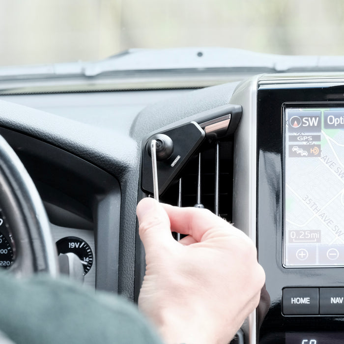 Image of Offroam Mounting Base installed securely in Toyota Land Cruiser 200 2016-2021 This premium all metal phone mounting base installs easily without drilling or glue. Perfect placement without blocking screens, driver view, or air flow.