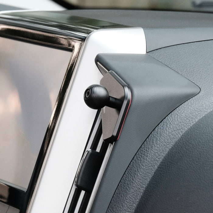 Image of Offroam Mounting Base installed securely in Toyota Land Cruiser 200 2016-2021. This premium all metal phone mounting base installs easily without drilling or glue. Perfect placement without blocking screens, driver view, or air flow.