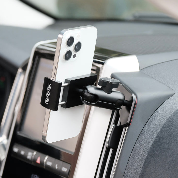 Image of Offroam Phone Mount installed securely in Toyota Land Cruiser 200 2016-2021. This premium phone mount installs easily without drilling or glue. Spring loaded Universal holder for use with any phone. Perfect placement without blocking screens, driver view, or air flow. Fully adjustable positioning.