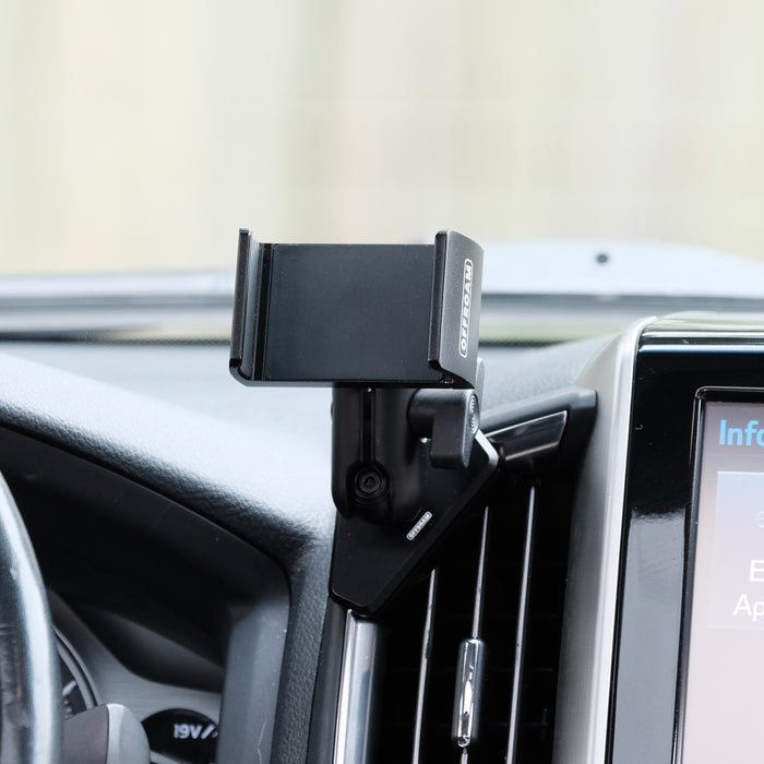 Image of Offroam Phone Mount installed securely in Toyota Land Cruiser 200 2016-2021. This premium phone mount installs easily without drilling or glue. Spring loaded Universal holder for use with any phone. Perfect placement without blocking screens, driver view, or air flow. Fully adjustable positioning.