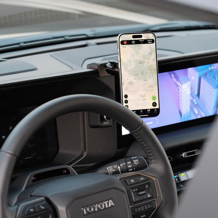 Image of Offroam MagSafe-compatible Phone Mount installed securely in Toyota Land Cruiser 250 2024-2027. This premium phone mount installs easily without drilling or glue. High force magnets hold phone on any trail, road, or track. Perfect placement without blocking screens, driver view, or air flow. Fully adjustable positioning.