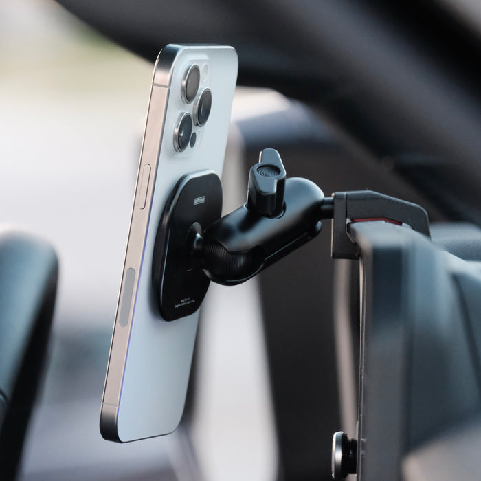 Image of Offroam MagSafe-compatible Phone Mount installed securely in Toyota Land Cruiser 250 2024-2027. This premium phone mount installs easily without drilling or glue. High force magnets hold phone on any trail, road, or track. Perfect placement without blocking screens, driver view, or air flow. Fully adjustable positioning.