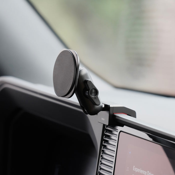 Image of Offroam MagSafe-compatible Phone Mount installed securely in Toyota Land Cruiser 250 2024-2027. This premium phone mount installs easily without drilling or glue. High force magnets hold phone on any trail, road, or track. Perfect placement without blocking screens, driver view, or air flow. Fully adjustable positioning.