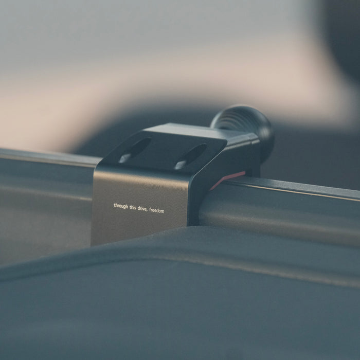 Image of Offroam Mounting Base installed securely in Toyota Land Cruiser 250 2024-2027. This premium all metal phone mounting base installs easily without drilling or glue. Perfect placement without blocking screens, driver view, or air flow.