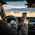 Image of Offroam Phone Mount XOVERLAND Edition installed securely in Toyota Land Cruiser 250 2024-2027. This premium phone mount installs easily without drilling or glue. Spring loaded Universal holder for use with any phone. Perfect placement without blocking screens, driver view, or air flow. Fully adjustable positioning.
