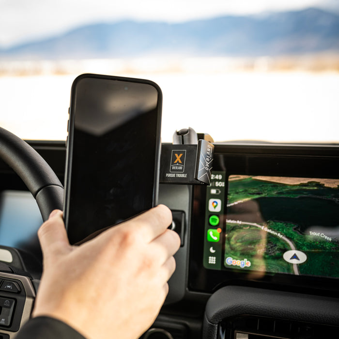Image of Offroam Phone Mount XOVERLAND Edition installed securely in Toyota Land Cruiser 250 2024-2027. This premium phone mount installs easily without drilling or glue. Spring loaded Universal holder for use with any phone. Perfect placement without blocking screens, driver view, or air flow. Fully adjustable positioning.