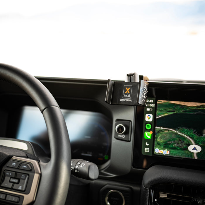 Image of Offroam Phone Mount XOVERLAND Edition installed securely in Toyota Land Cruiser 250 2024-2027. This premium phone mount installs easily without drilling or glue. Spring loaded Universal holder for use with any phone. Perfect placement without blocking screens, driver view, or air flow. Fully adjustable positioning.
