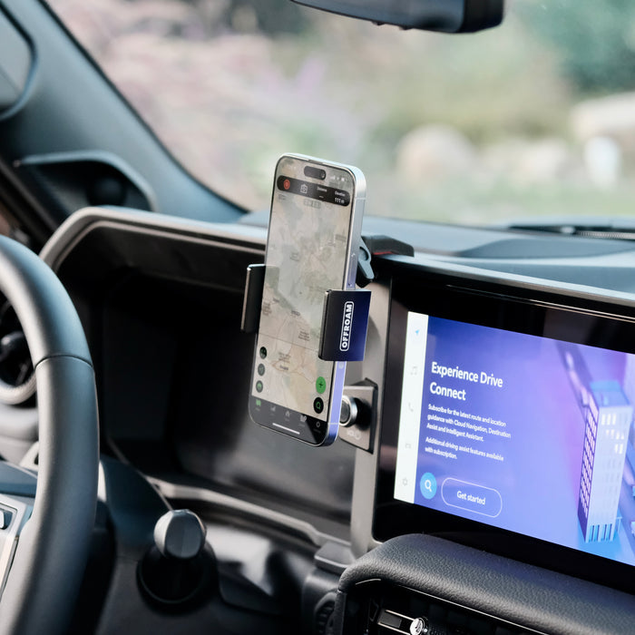 Image of Offroam Phone Mount installed securely in Toyota Land Cruiser 250 2024-2027. This premium phone mount installs easily without drilling or glue. Spring loaded Universal holder for use with any phone. Perfect placement without blocking screens, driver view, or air flow. Fully adjustable positioning.