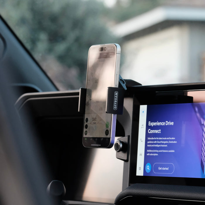 Image of Offroam Phone Mount installed securely in Toyota Land Cruiser 250 2024-2027. This premium phone mount installs easily without drilling or glue. Spring loaded Universal holder for use with any phone. Perfect placement without blocking screens, driver view, or air flow. Fully adjustable positioning.