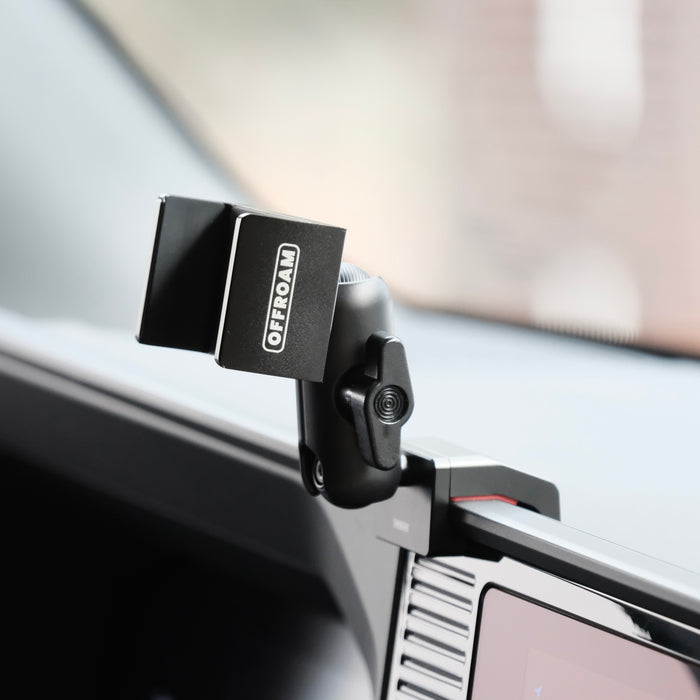Image of Offroam Phone Mount installed securely in Toyota Land Cruiser 250 2024-2027. This premium phone mount installs easily without drilling or glue. Spring loaded Universal holder for use with any phone. Perfect placement without blocking screens, driver view, or air flow. Fully adjustable positioning.