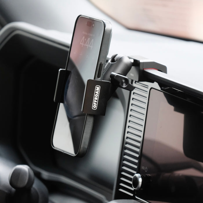 Image of Offroam Phone Mount installed securely in Toyota Land Cruiser 250 2024-2027. This premium phone mount installs easily without drilling or glue. Spring loaded Universal holder for use with any phone. Perfect placement without blocking screens, driver view, or air flow. Fully adjustable positioning.