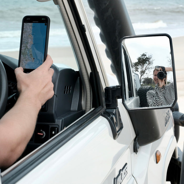 Image of Offroam MagSafe-compatible Phone Mount installed securely in Toyota Land Cruiser 70 2007-2026. This premium phone mount installs easily without drilling or glue. High force magnets hold phone on any trail, road, or track. Perfect placement without blocking screens, driver view, or air flow. Fully adjustable positioning.