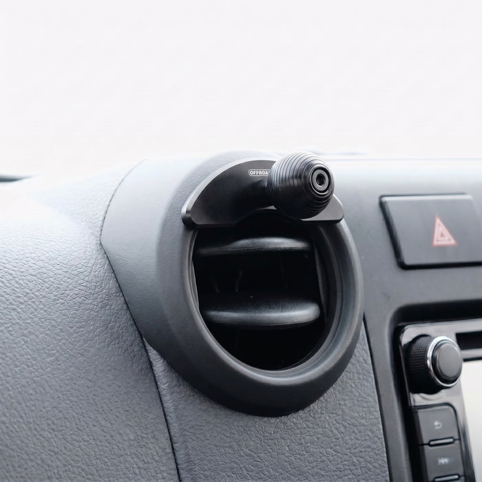 Image of Offroam Mounting Base installed securely in Toyota Land Cruiser 70 2007-2026. This premium all metal phone mounting base installs easily without drilling or glue. Perfect placement without blocking screens, driver view, or air flow.