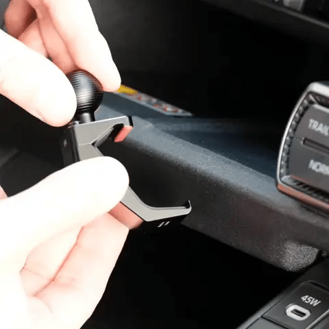 Animation of Offroam Mounting Base installation for Toyota RAV4 2026, Center Console. This premium all metal phone mounting base installs easily without drilling or glue. Perfect placement without blocking screens, driver view, or air flow.