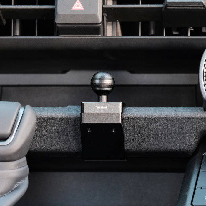 Image of Offroam Mounting Base installed securely in Toyota RAV4 2026, Center Console. This premium all metal phone mounting base installs easily without drilling or glue. Perfect placement without blocking screens, driver view, or air flow.