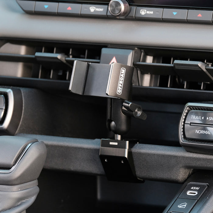 Image of Offroam Phone Mount installed securely in Toyota RAV4 2026. This premium phone mount installs easily without drilling or glue. Spring loaded Universal holder for use with any phone. Perfect placement without blocking screens, driver view, or air flow. Fully adjustable positioning.