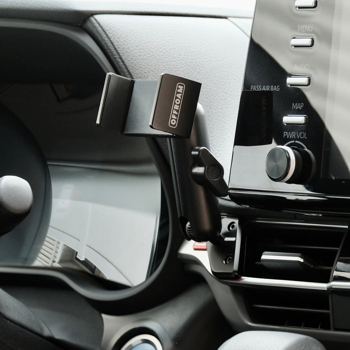 Image of Offroam Phone Mount installed securely in Toyota Sienna 2021-2026. This premium phone mount installs easily without drilling or glue. Spring loaded Universal holder for use with any phone. Perfect placement without blocking screens, driver view, or air flow. Fully adjustable positioning.