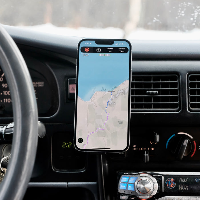 Image of Offroam MagSafe-compatible Phone Mount installed securely in Toyota Tacoma 1996-2004. This premium phone mount installs easily without drilling or glue. High force magnets hold phone on any trail, road, or track. Perfect placement without blocking screens, driver view, or air flow. Fully adjustable positioning.