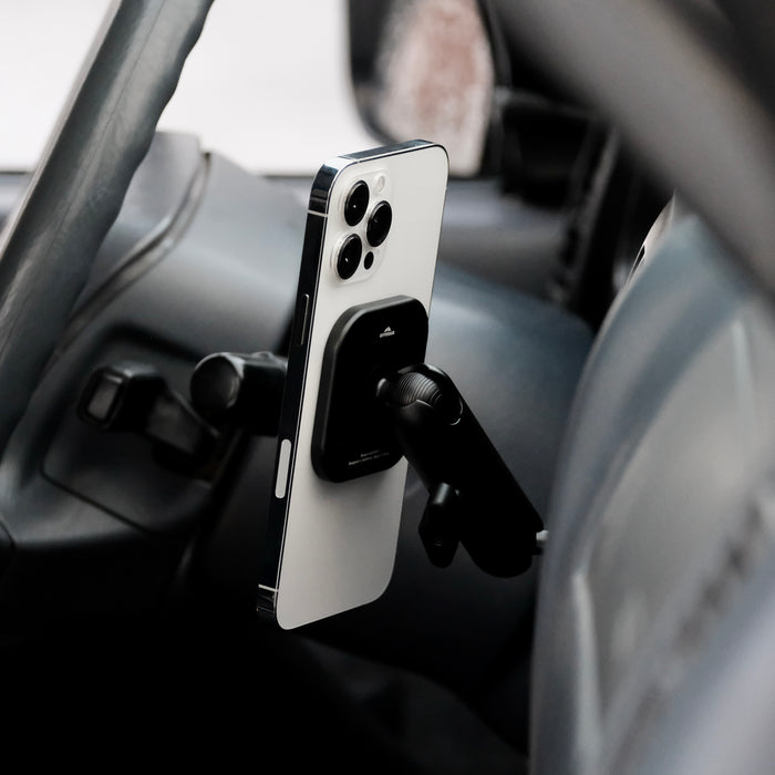 Image of Offroam MagSafe-compatible Phone Mount installed securely in Toyota Tacoma 1996-2004. This premium phone mount installs easily without drilling or glue. High force magnets hold phone on any trail, road, or track. Perfect placement without blocking screens, driver view, or air flow. Fully adjustable positioning.