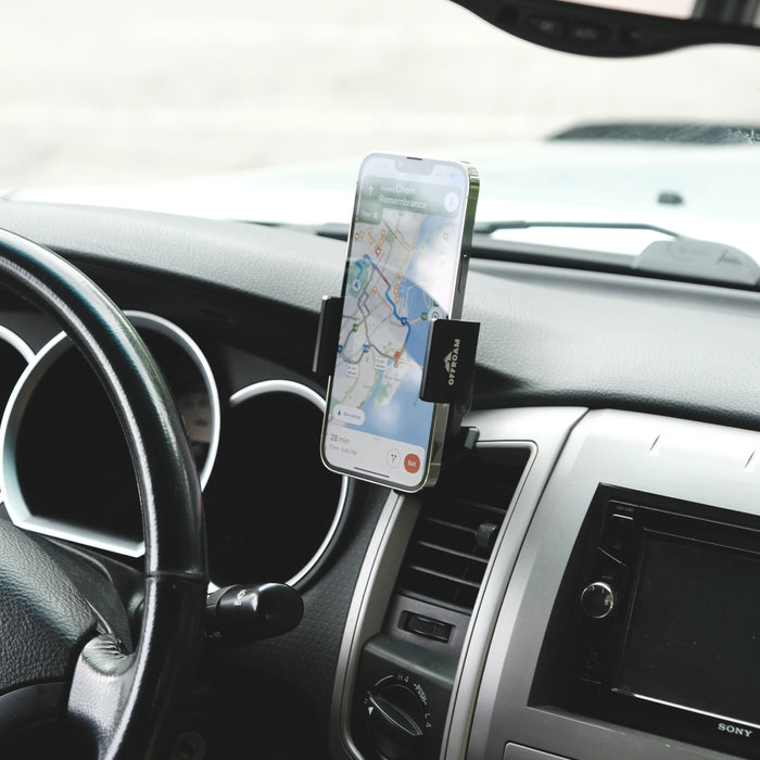 Image of Offroam Phone Mount installed securely in Toyota Tacoma 2005-2011. This premium phone mount installs easily without drilling or glue. Spring loaded Universal holder for use with any phone. Perfect placement without blocking screens, driver view, or air flow. Fully adjustable positioning.