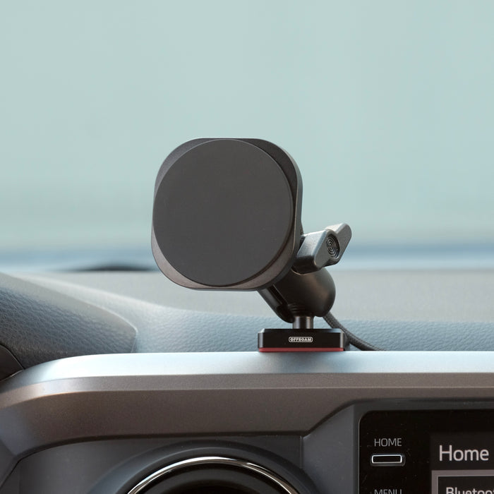 Image of Offroam MagSafe-compatible Phone Mount installed securely in Toyota Tacoma 2016-2023. This premium phone mount installs easily without drilling or glue. High force magnets hold phone on any trail, road, or track. Perfect placement without blocking screens, driver view, or air flow. Fully adjustable positioning.