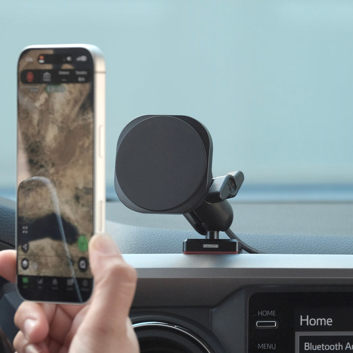 Image of Offroam MagSafe-compatible Phone Mount installed securely in Toyota Tacoma 2016-2023. This premium phone mount installs easily without drilling or glue. High force magnets hold phone on any trail, road, or track. Perfect placement without blocking screens, driver view, or air flow. Fully adjustable positioning.