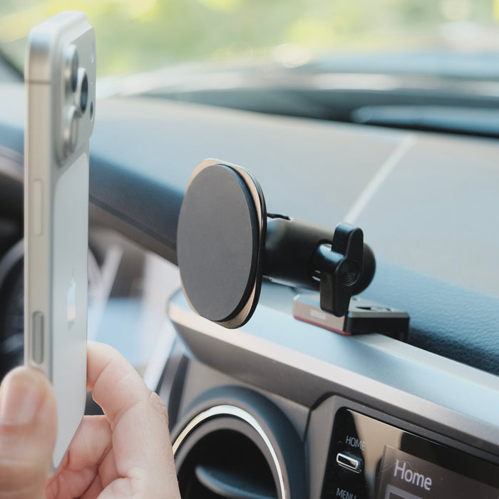 Image of Offroam MagSafe-compatible Phone Mount installed securely in Toyota Tacoma 2016-2023. This premium phone mount installs easily without drilling or glue. High force magnets hold phone on any trail, road, or track. Perfect placement without blocking screens, driver view, or air flow. Fully adjustable positioning.