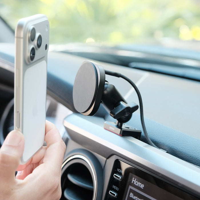Image of Offroam MagSafe-compatible Phone Mount installed securely in Toyota Tacoma 2016-2023. This premium phone mount installs easily without drilling or glue. High force magnets hold phone on any trail, road, or track. Perfect placement without blocking screens, driver view, or air flow. Fully adjustable positioning.