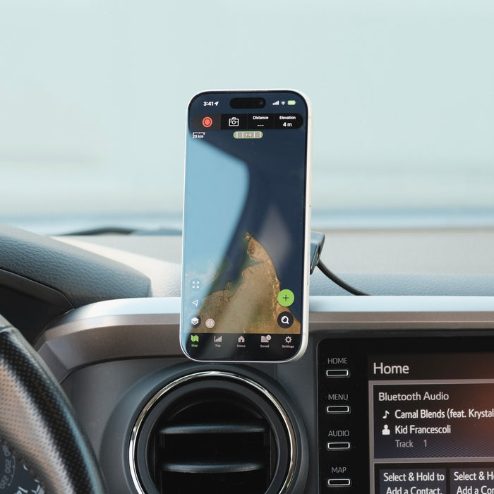 Image of Offroam MagSafe-compatible Phone Mount installed securely in Toyota Tacoma 2016-2023. This premium phone mount installs easily without drilling or glue. High force magnets hold phone on any trail, road, or track. Perfect placement without blocking screens, driver view, or air flow. Fully adjustable positioning.