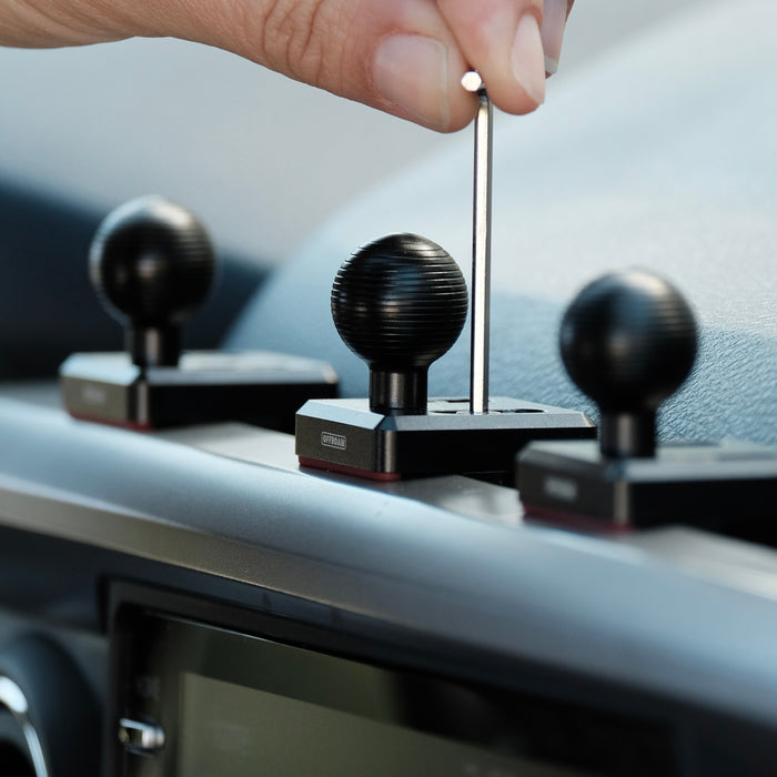 Image of Offroam Mounting Bases installed securely in Toyota Tacoma 2016-2023. This premium all metal phone mounting base installs easily without drilling or glue. Perfect placement without blocking screens, driver view, or air flow.
