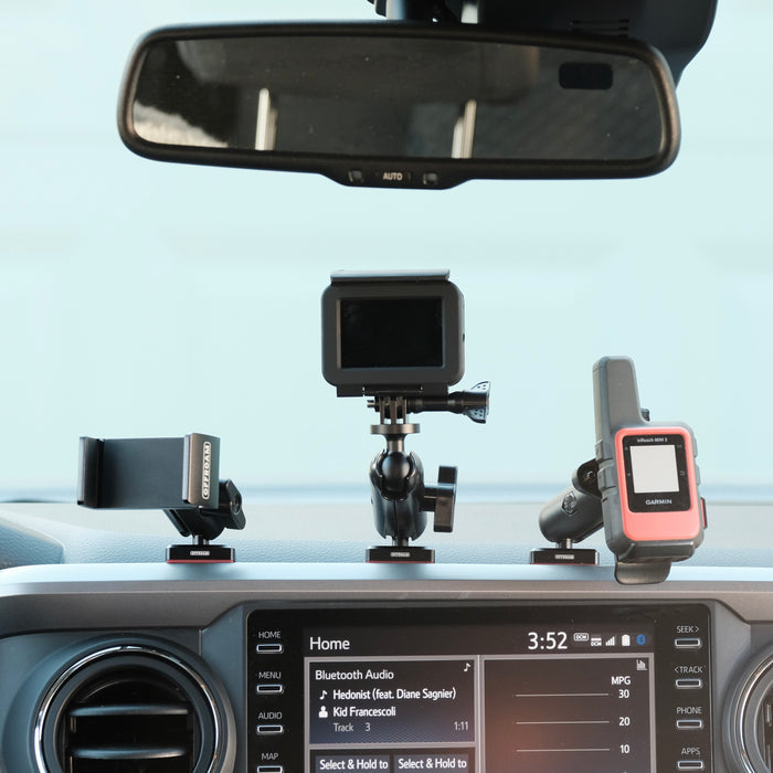 Image of Offroam Phone Mounts installed securely in Toyota Tacoma 2016-2023. This premium phone mount installs easily without drilling or glue. Spring loaded Universal holder for use with any phone. Perfect placement without blocking screens, driver view, or air flow. Fully adjustable positioning.