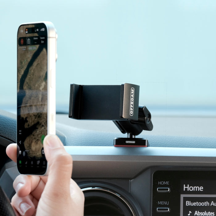 Image of Offroam Phone Mount installed securely in Toyota Tacoma 2016-2023. This premium phone mount installs easily without drilling or glue. Spring loaded Universal holder for use with any phone. Perfect placement without blocking screens, driver view, or air flow. Fully adjustable positioning.